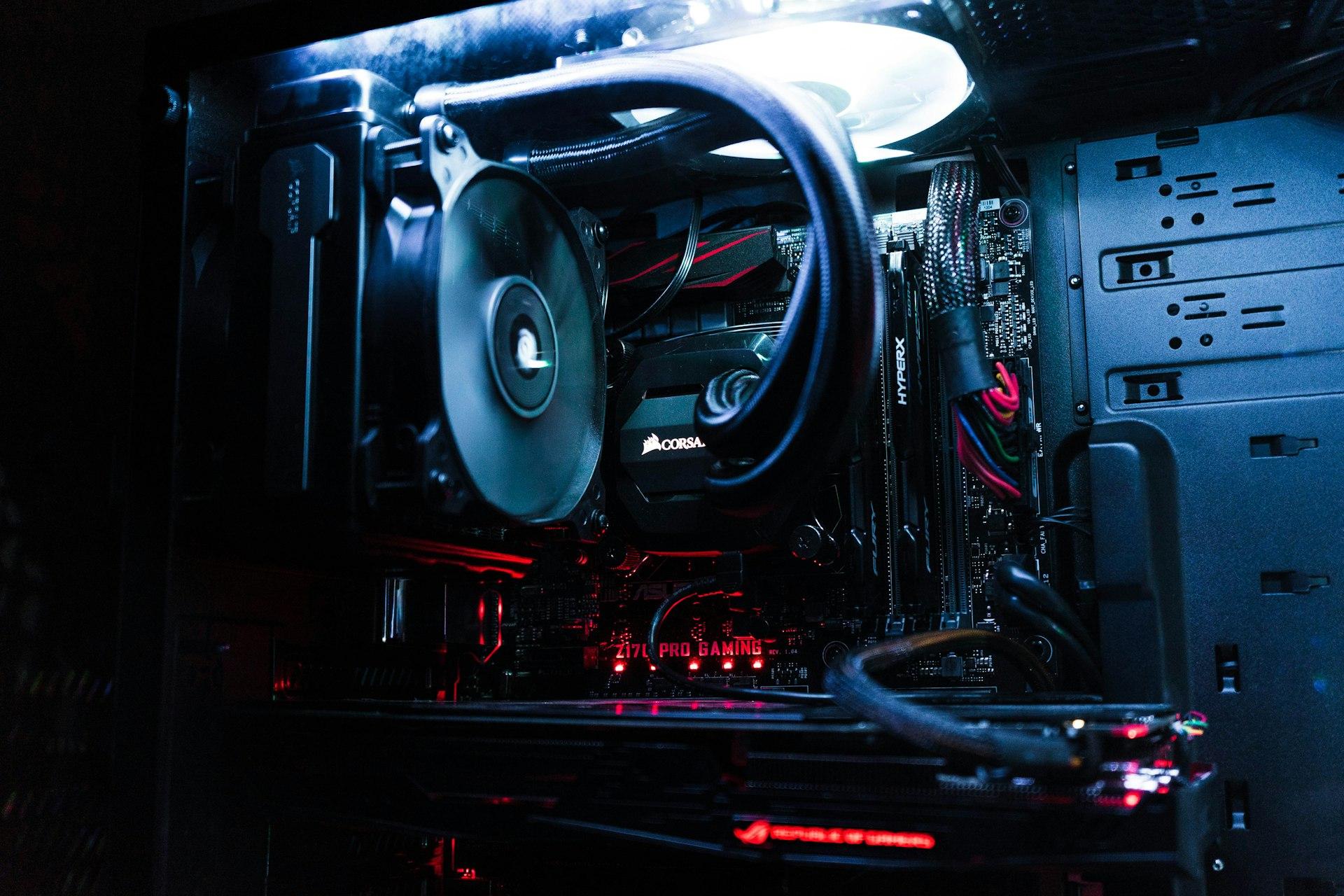 Open desktop computer showing internal repair components and cooling hardware